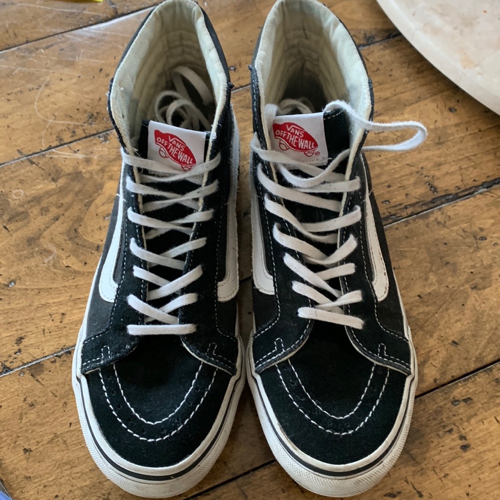 Vans black suede high top sneakers.